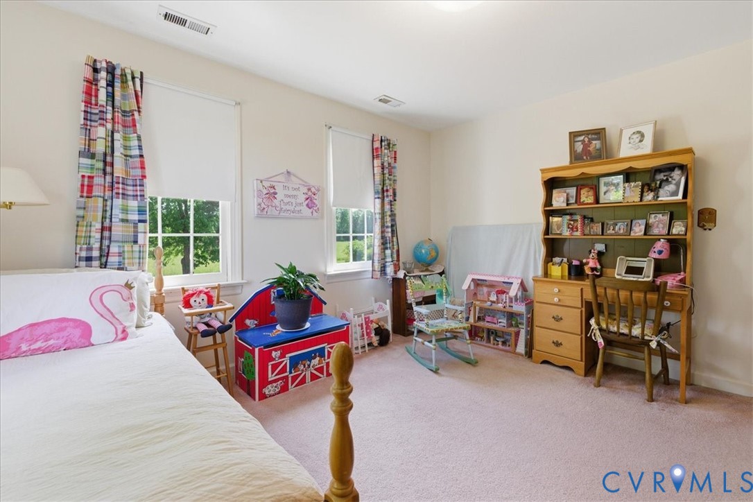 15414 Sunnybrook Road Petersburg, VA 23805 - Photo 23 of 29 a living room with furniture and a bookshelf