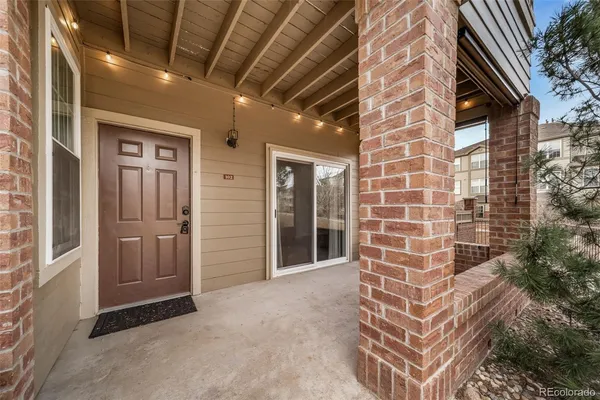 a view of a hallway with brick walls