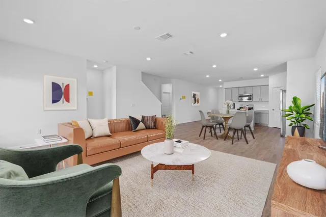 a view of wooden floor and windows in a room