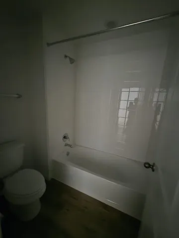 a view of a bathroom from a hallway