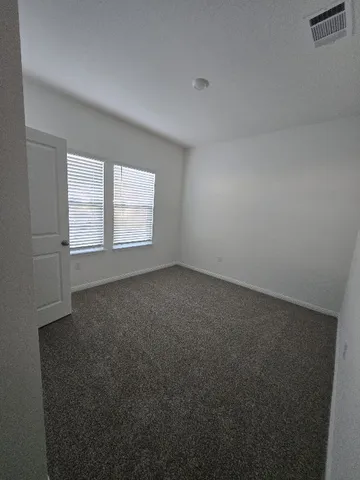 a bathroom with a toilet and a bathtub