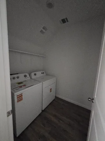 a en suite bathroom with a double vanity sink and a mirror