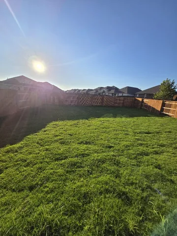 a view of an mountain with sunset in background