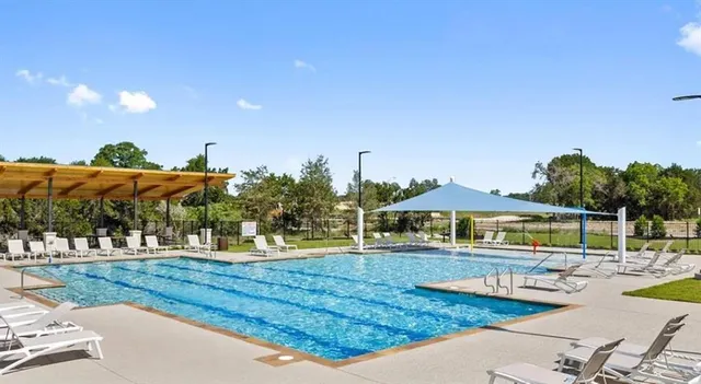 a patio with table and chairs