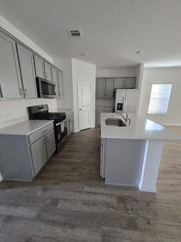 a view of gallery with wooden floor