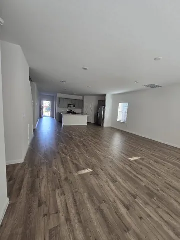 a kitchen with stainless steel appliances a sink stove top oven and cabinets