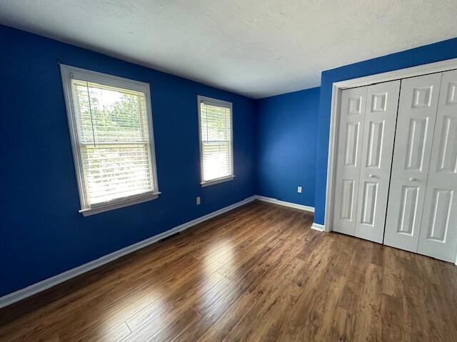 709 Old Barnstable Road Mashpee, MA 02649 - Photo 12 of 32 a view of empty room with wooden floor and fan