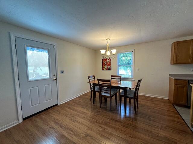 709 Old Barnstable Road Mashpee, MA 02649 - Photo 16 of 32 a view of a dining room with furniture and chandelier