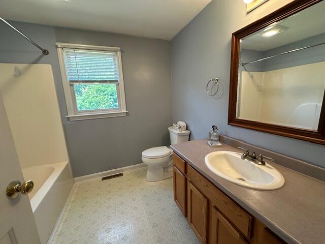 709 Old Barnstable Road Mashpee, MA 02649 - Photo 20 of 32 a bathroom with a granite countertop sink toilet and a mirror