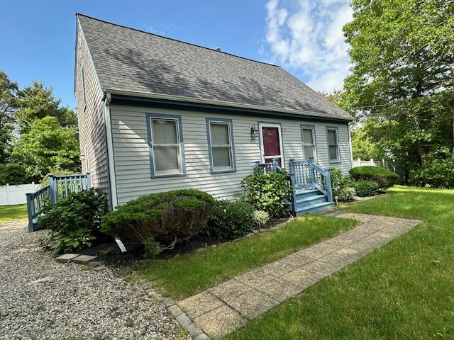 709 Old Barnstable Road Mashpee, MA 02649 - Photo 2 of 32 a front view of a house with garden