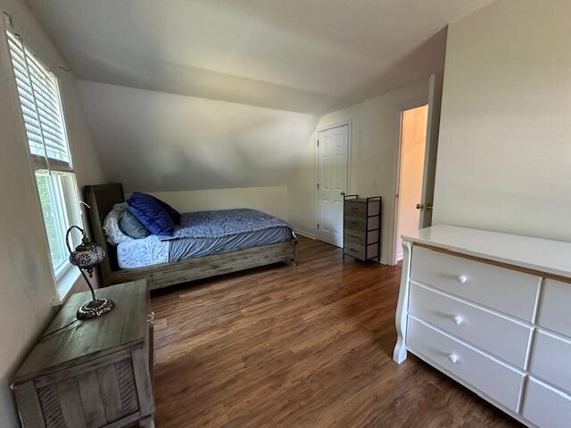 709 Old Barnstable Road Mashpee, MA 02649 - Photo 22 of 32 a bedroom with a bed and wooden floor