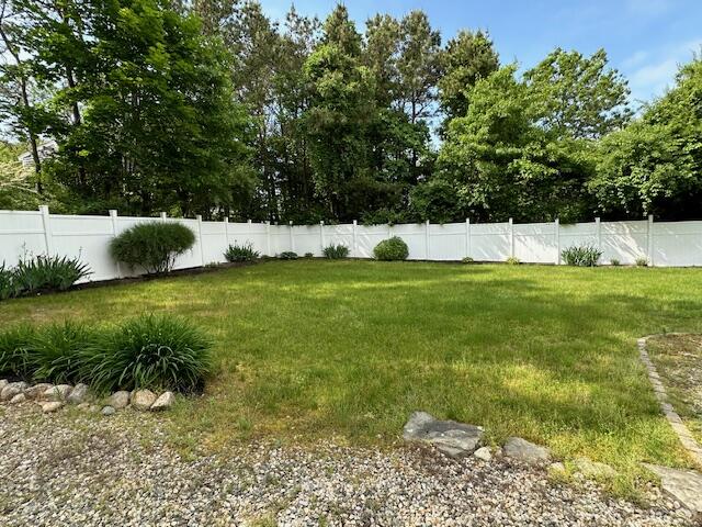 709 Old Barnstable Road Mashpee, MA 02649 - Photo 31 of 32 a view of a field of grass and trees