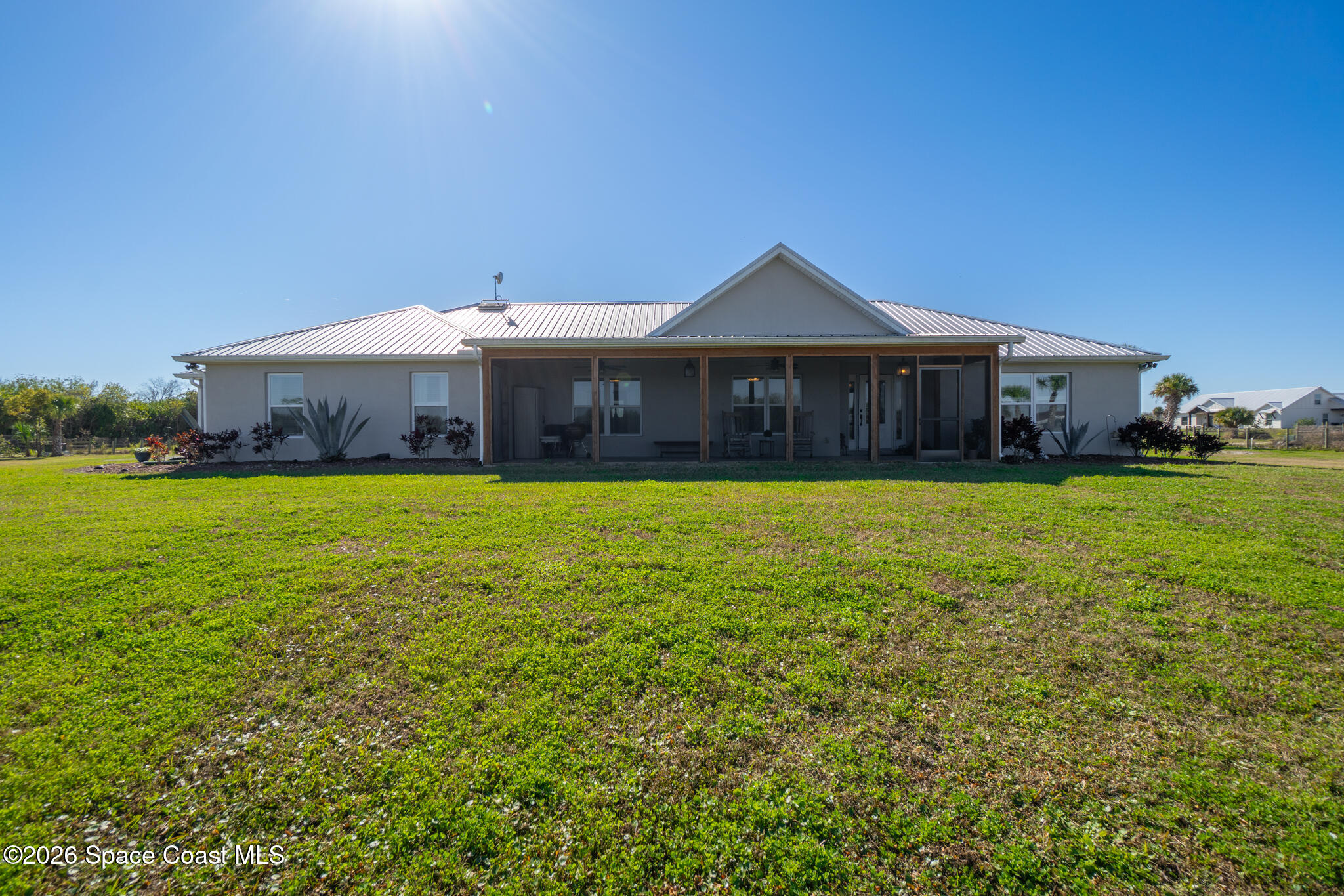 3440 Hammock Road Mims, FL 32754 - Photo 56 of 59 a front view of a house with yard and green space