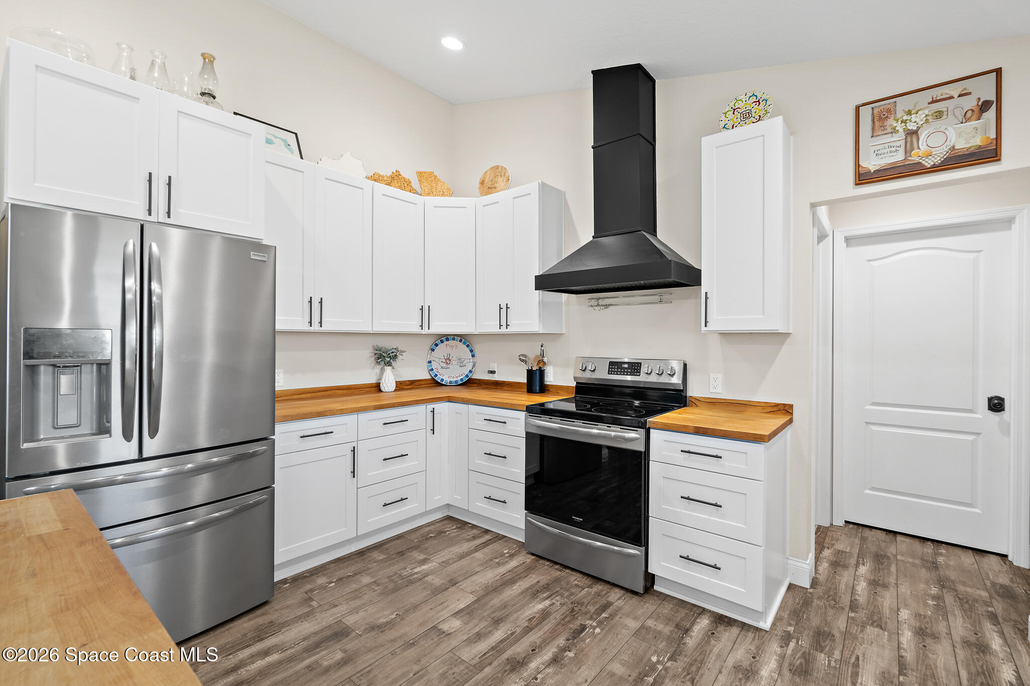 3440 Hammock Road Mims, FL 32754 - Photo 38 of 59 a kitchen with stainless steel appliances granite countertop a refrigerator stove and sink