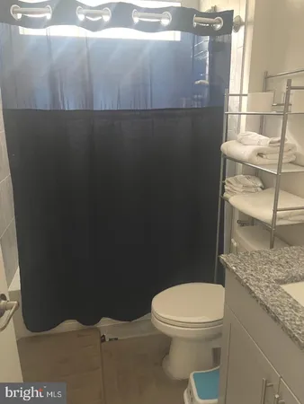 a bathroom with a toilet and a vanity
