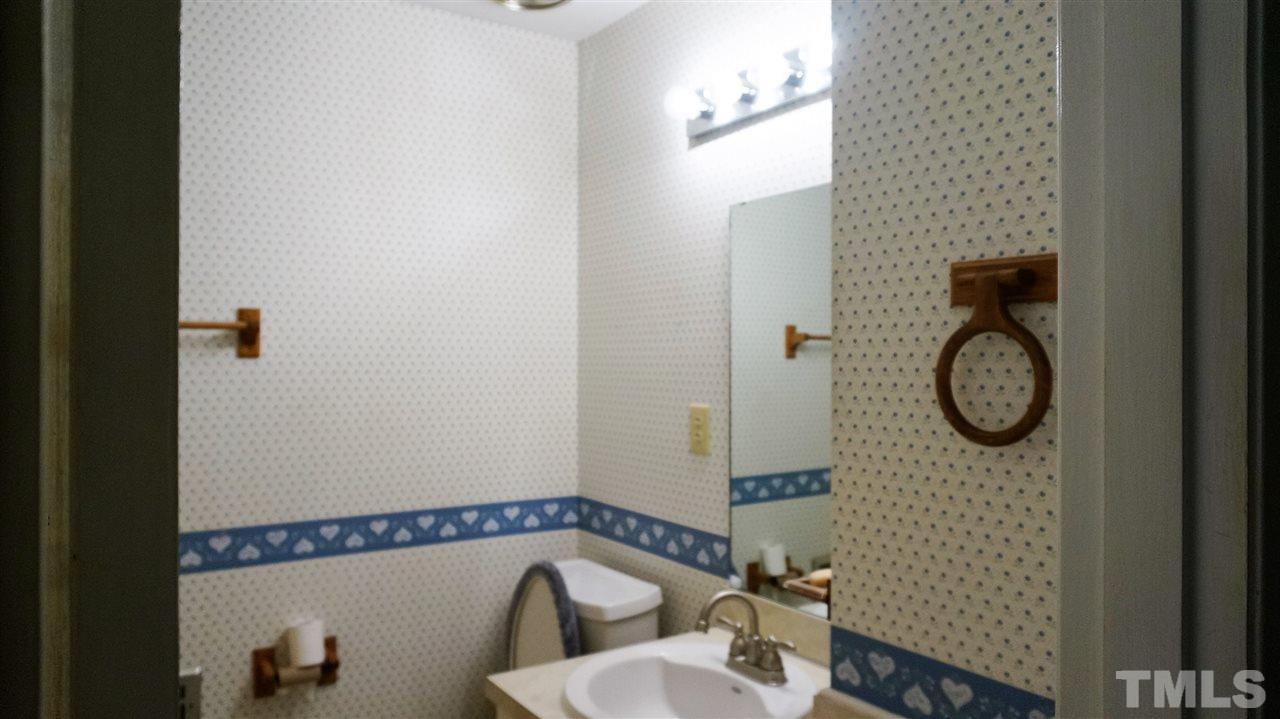 2613 Ramsey Road Raleigh, NC 27604 - Photo 14 of 23 a bathroom with a sink a toilet and a shower