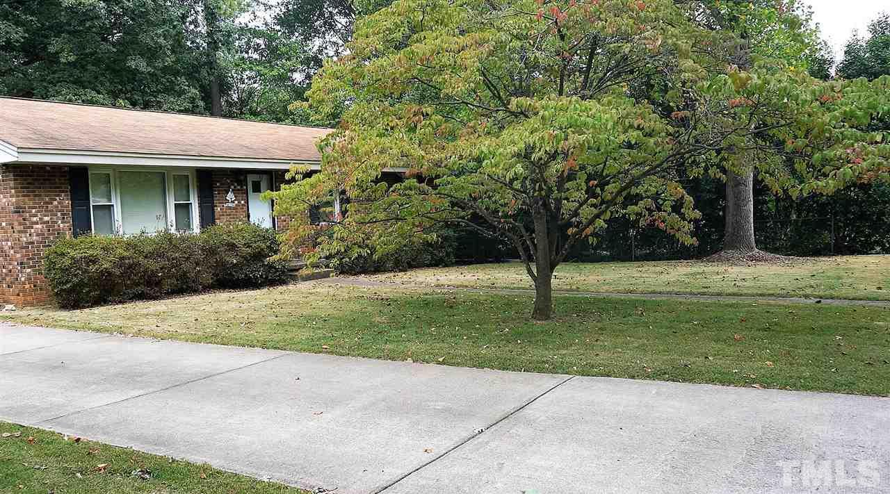 2613 Ramsey Road Raleigh, NC 27604 - Photo 21 of 23 a view of a wooden house with a yard