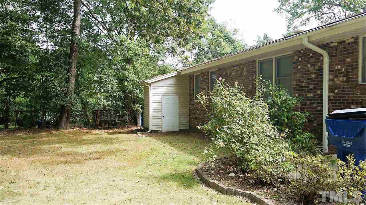 2613 Ramsey Road Raleigh, NC 27604 - Photo 22 of 23 a backyard of a house with lots of green space