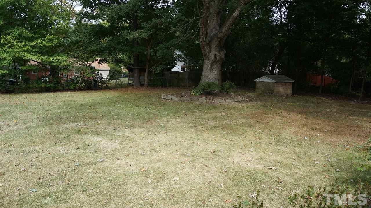 2613 Ramsey Road Raleigh, NC 27604 - Photo 6 of 23 a backyard of a house with lots of green space