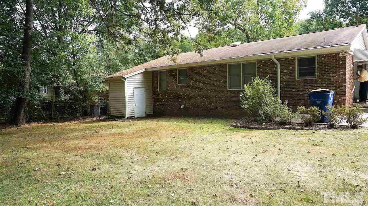 2613 Ramsey Road Raleigh, NC 27604 - Photo 7 of 23 a house with trees in front of it