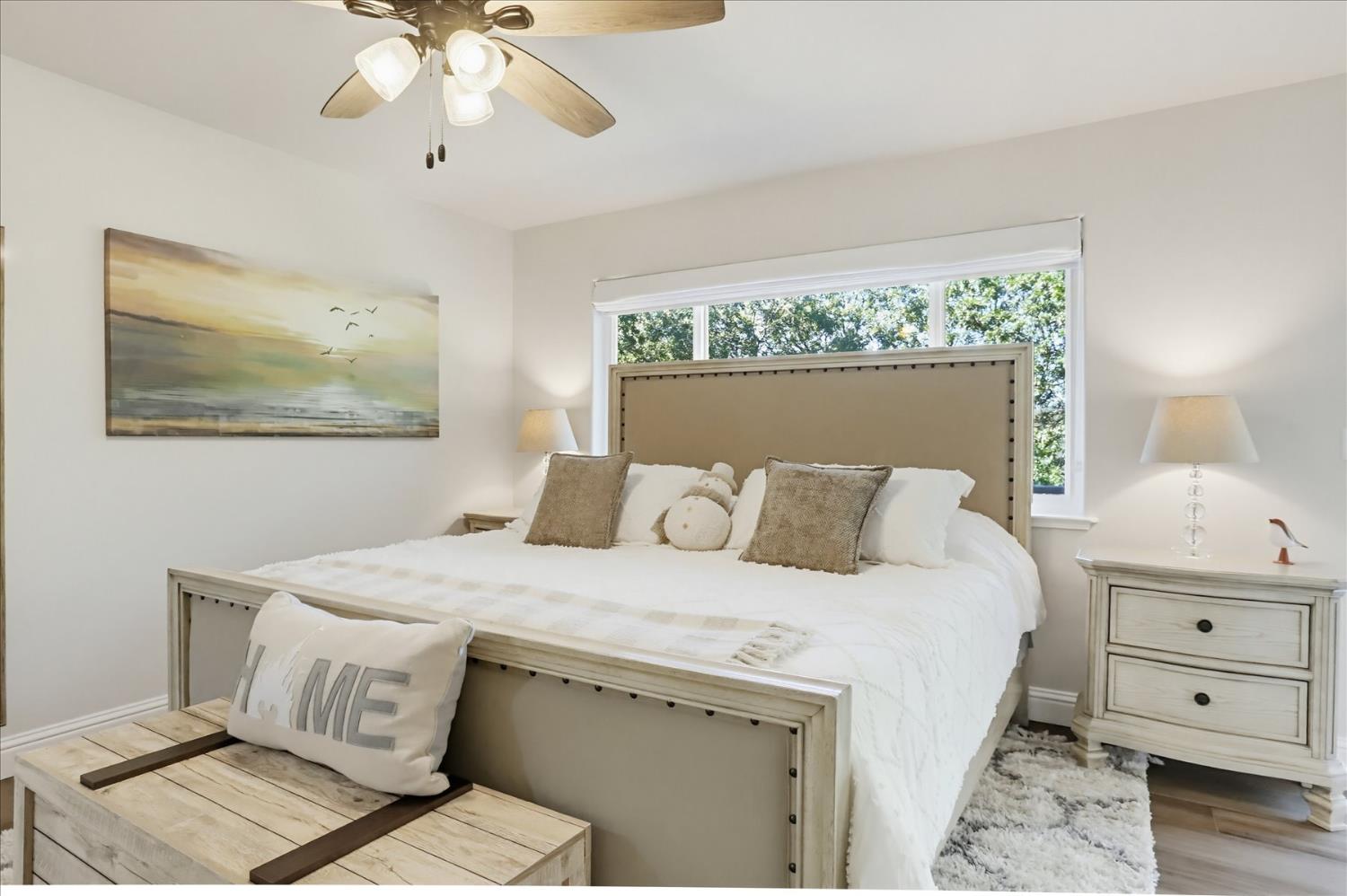 18639 Fay Ridge Court Grass Valley, CA 95949 - Photo 25 of 99 a bedroom with a bed and a chandelier