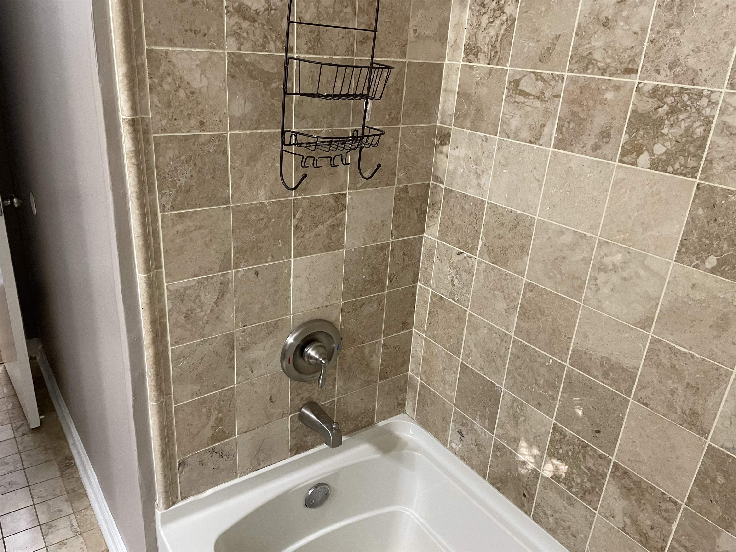 4615 Berta Road Memphis, TN 38109 - Photo 14 of 19 a bathroom with a shower and a sink