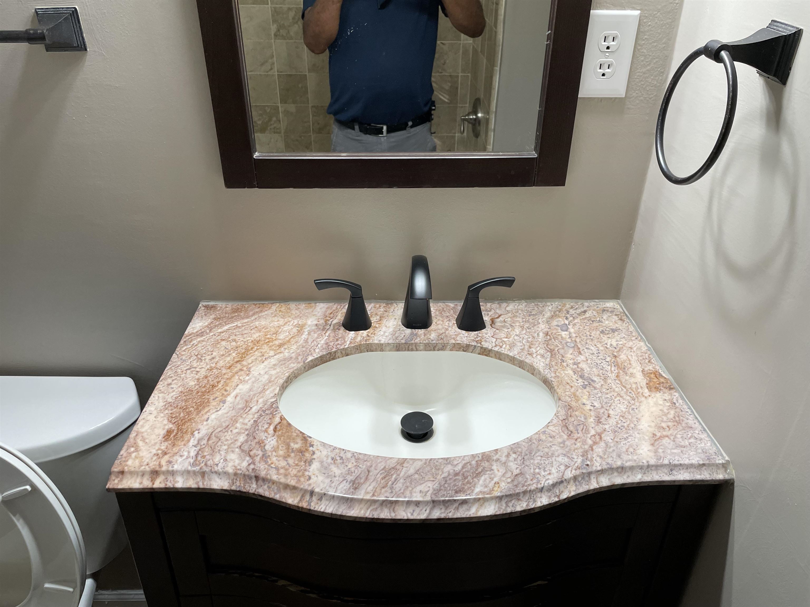 4615 Berta Road Memphis, TN 38109 - Photo 15 of 19 a bathroom with a granite countertop sink and a mirror
