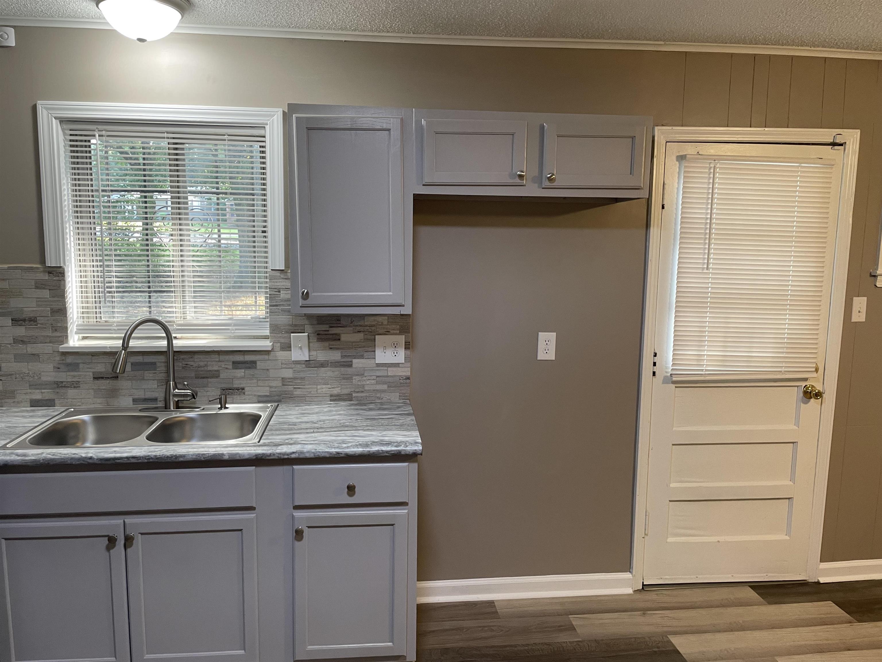 4615 Berta Road Memphis, TN 38109 - Photo 18 of 19 a kitchen with a sink and a window