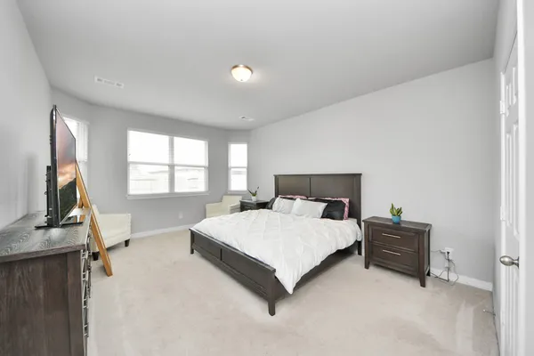 a bedroom with a bed and furniture