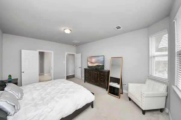 a bathroom with a granite countertop sink double and mirror