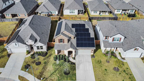 front view of a house with a yard