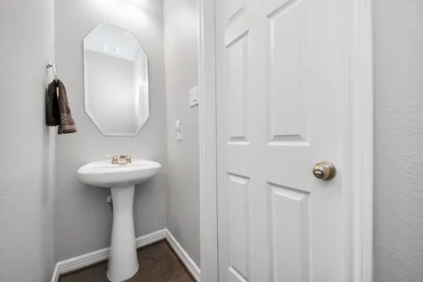 a bathroom with a sink and mirror