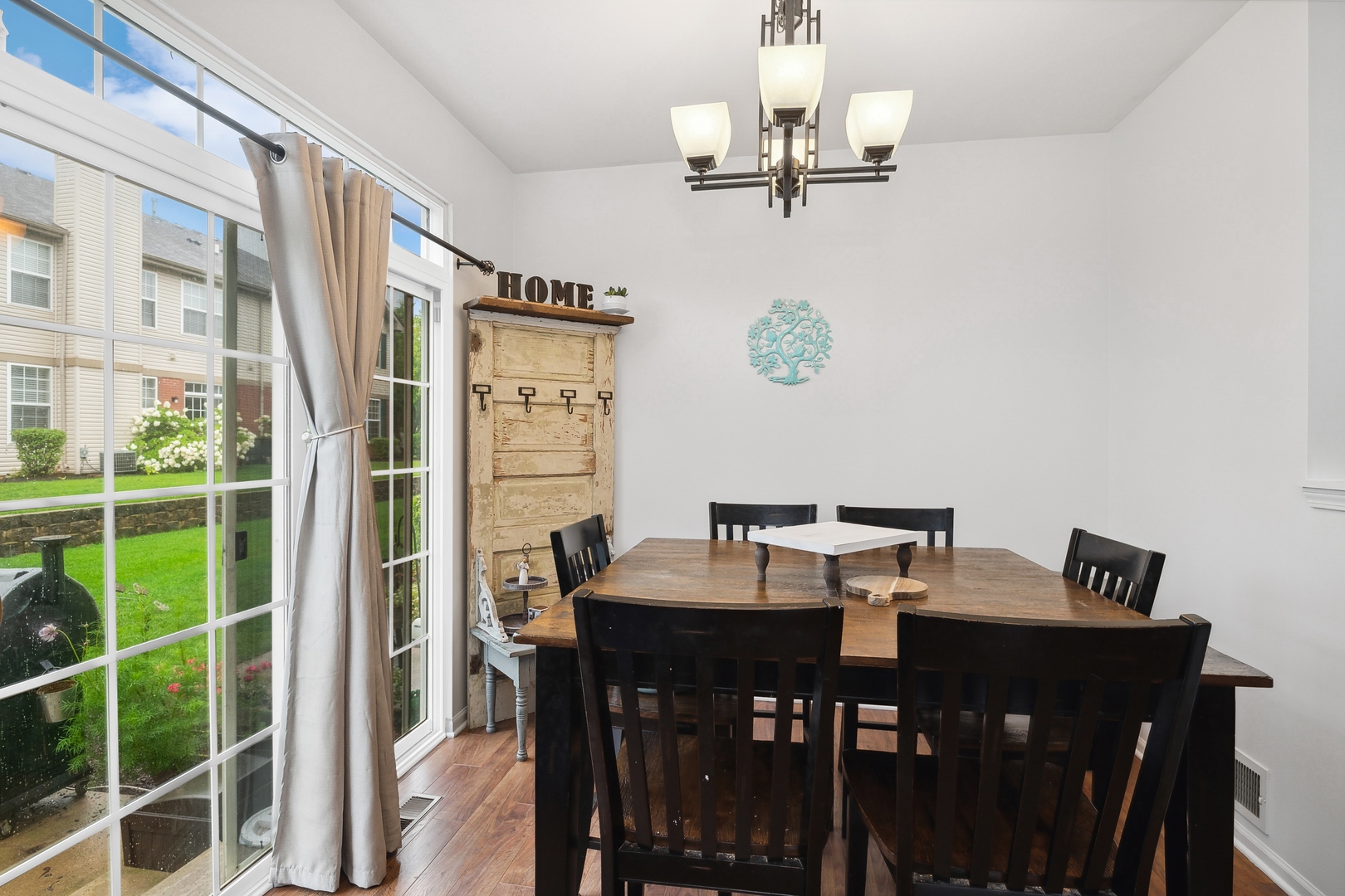 567 North Red Deer Road Round Lake, IL 60073 - Photo 3 of 3 a view of a dining room with furniture and chandelier