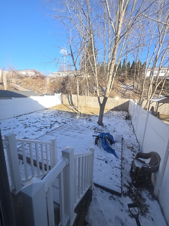 39 Adelaide Avenue, Unit 1 Methuen, MA 01844 - Photo 8 of 8 a view of a backyard with wooden fence