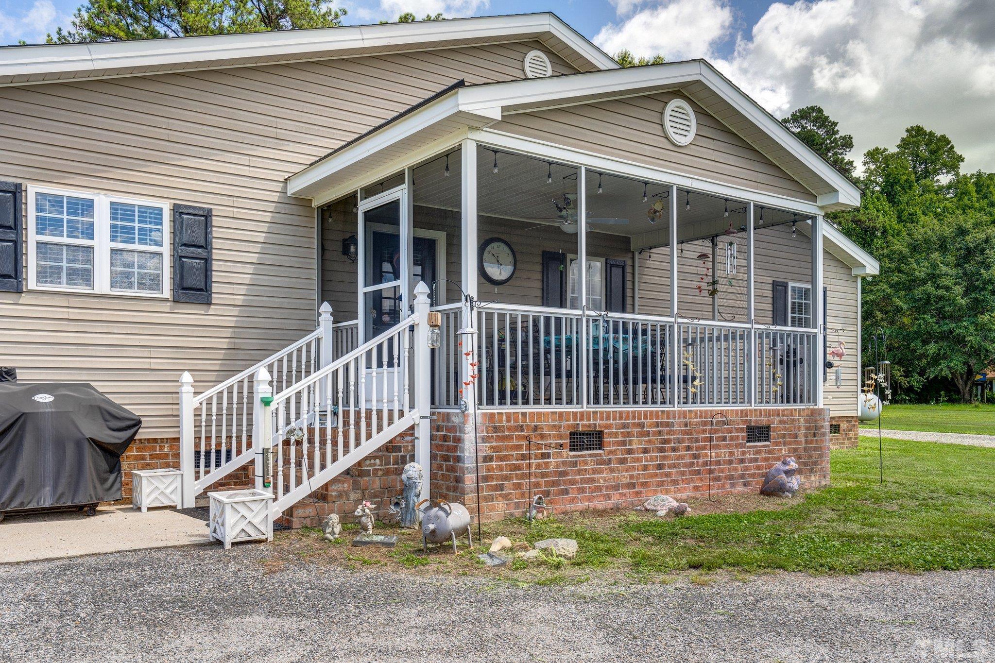 7349 Old Middlesex Road Bailey, NC 27807 - Photo 24 of 31 a view of a house with a yard