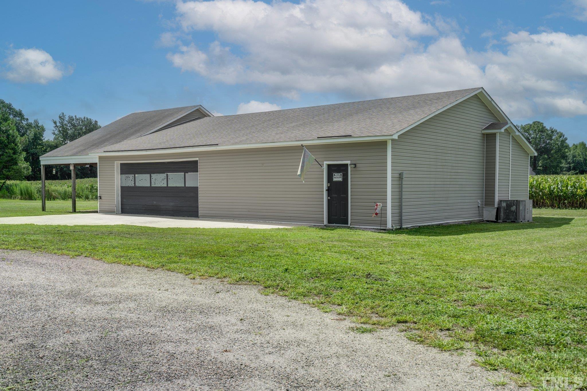 7349 Old Middlesex Road Bailey, NC 27807 - Photo 29 of 31 a front view of house with yard and green space