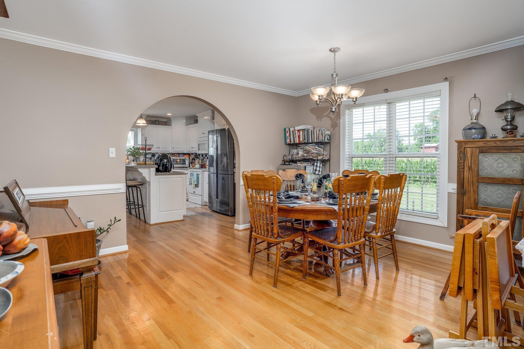 7349 Old Middlesex Road Bailey, NC 27807 - Photo 5 of 31 a view of a dining room with furniture window and wooden floor
