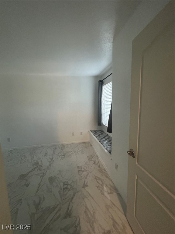 3145 East Flamingo Road, Unit 1014 Las Vegas, NV 89121 - Photo 13 of 17 Unfurnished room featuring light marble finish flooring and baseboards