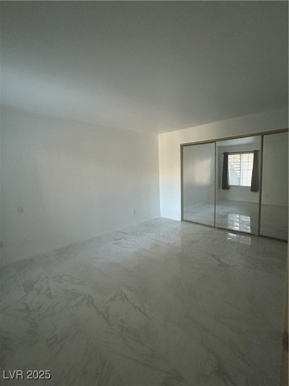 3145 East Flamingo Road, Unit 1014 Las Vegas, NV 89121 - Photo 16 of 17 Unfurnished bedroom with a closet