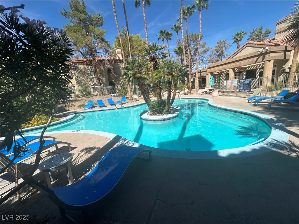 3145 East Flamingo Road, Unit 1014 Las Vegas, NV 89121 - Photo 2 of 17 Community pool featuring a patio