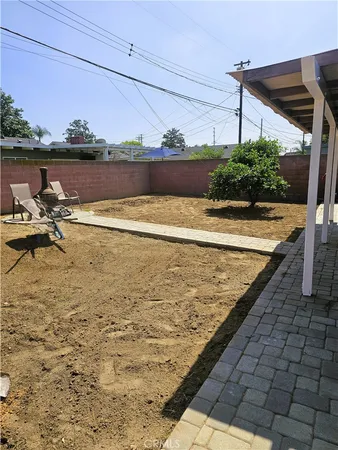 a view of a backyard and a patio