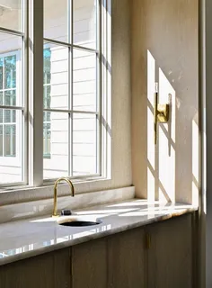 a view of a sink and a window