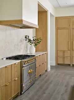 a kitchen with a stove and a refrigerator