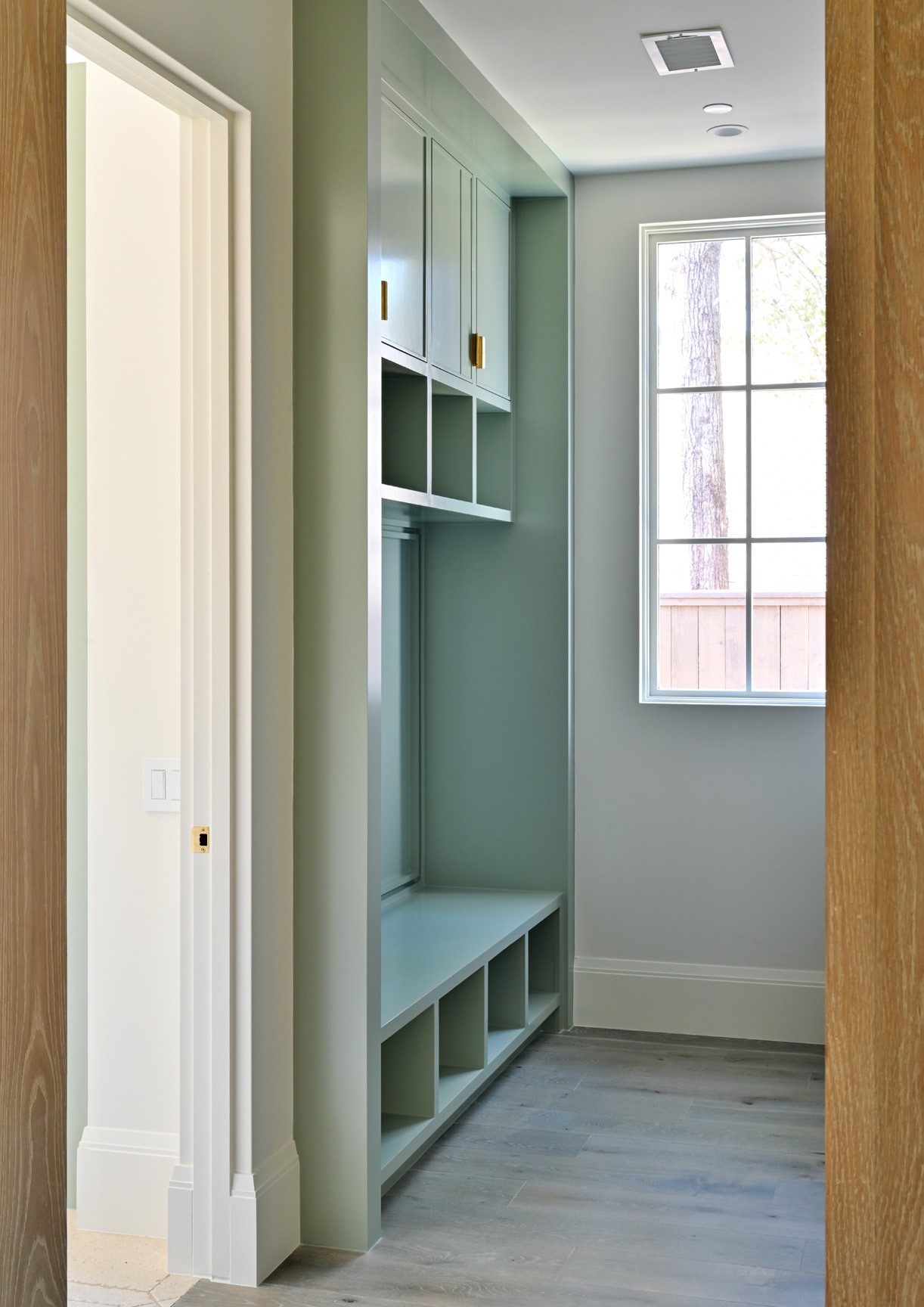 11710 Wendover Lane Houston, TX 77024 - Photo 18 of 50 Mudroom area with built-in storage located off the laundry room