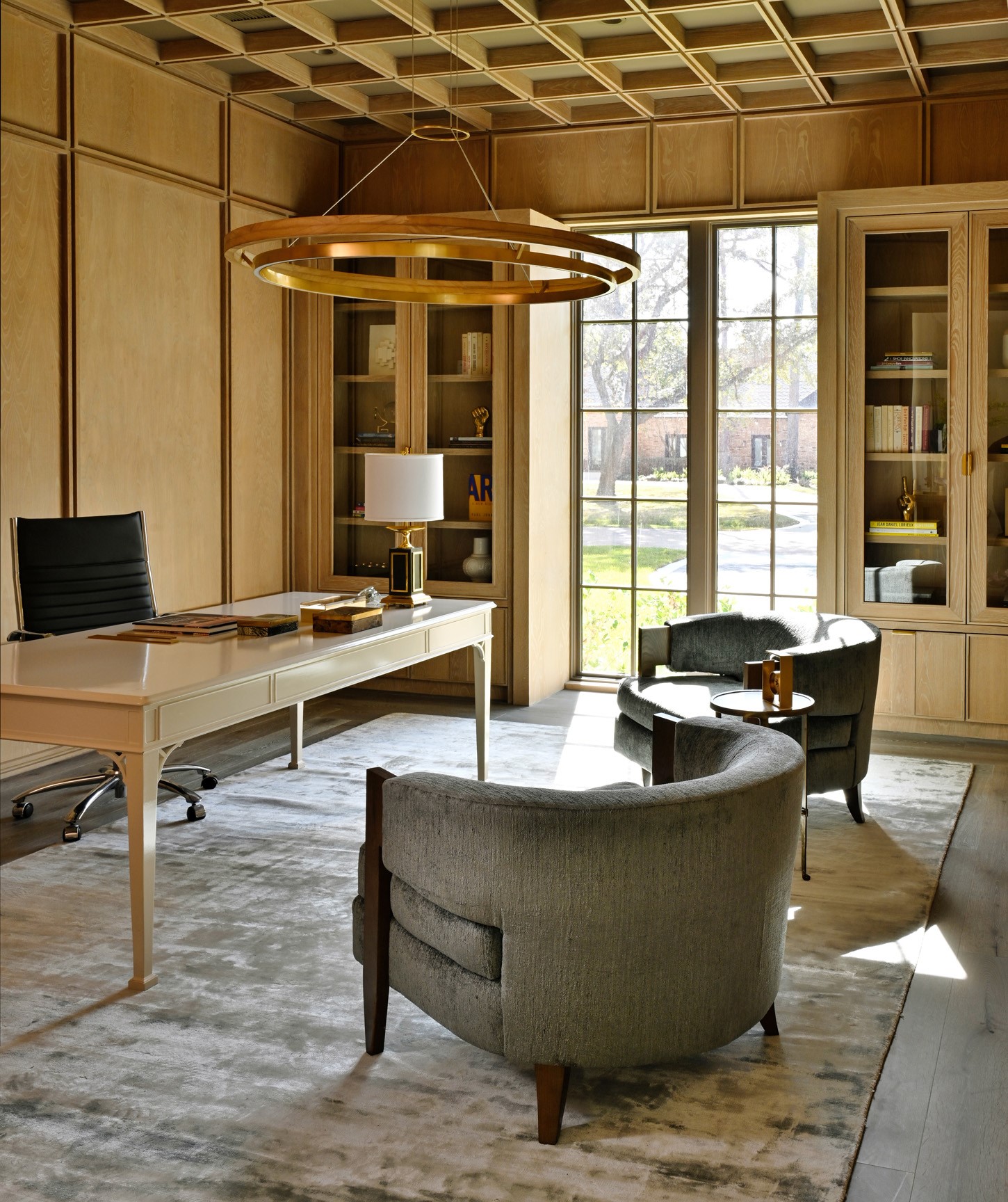 11710 Wendover Lane Houston, TX 77024 - Photo 22 of 50 Private study with built-in shelving, architectural wood paneling, and expansive windows