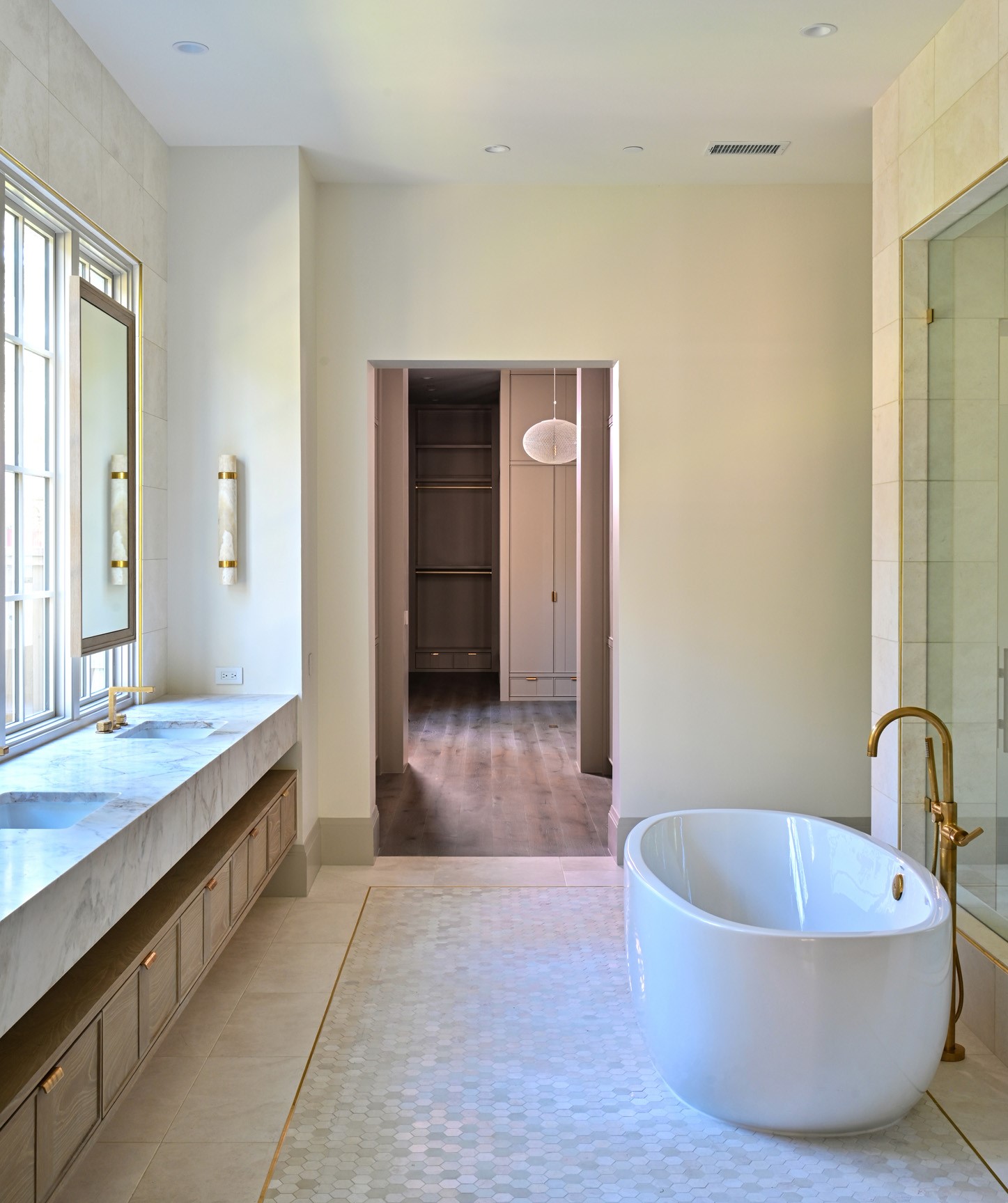 11710 Wendover Lane Houston, TX 77024 - Photo 26 of 50 Primary bathroom with soaking tub, walk-in shower, and dual vanities