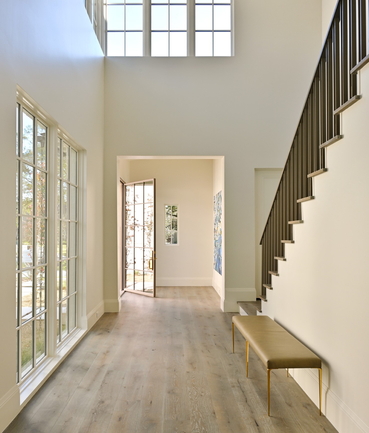 11710 Wendover Lane Houston, TX 77024 - Photo 4 of 50 Light-filled entry foyer with soaring ceiling height overlooking the entry garden