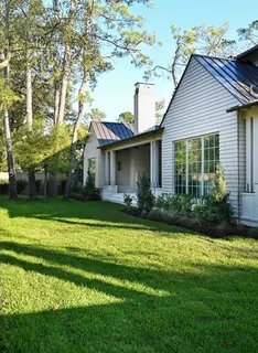 a front view of a house with garden and porch