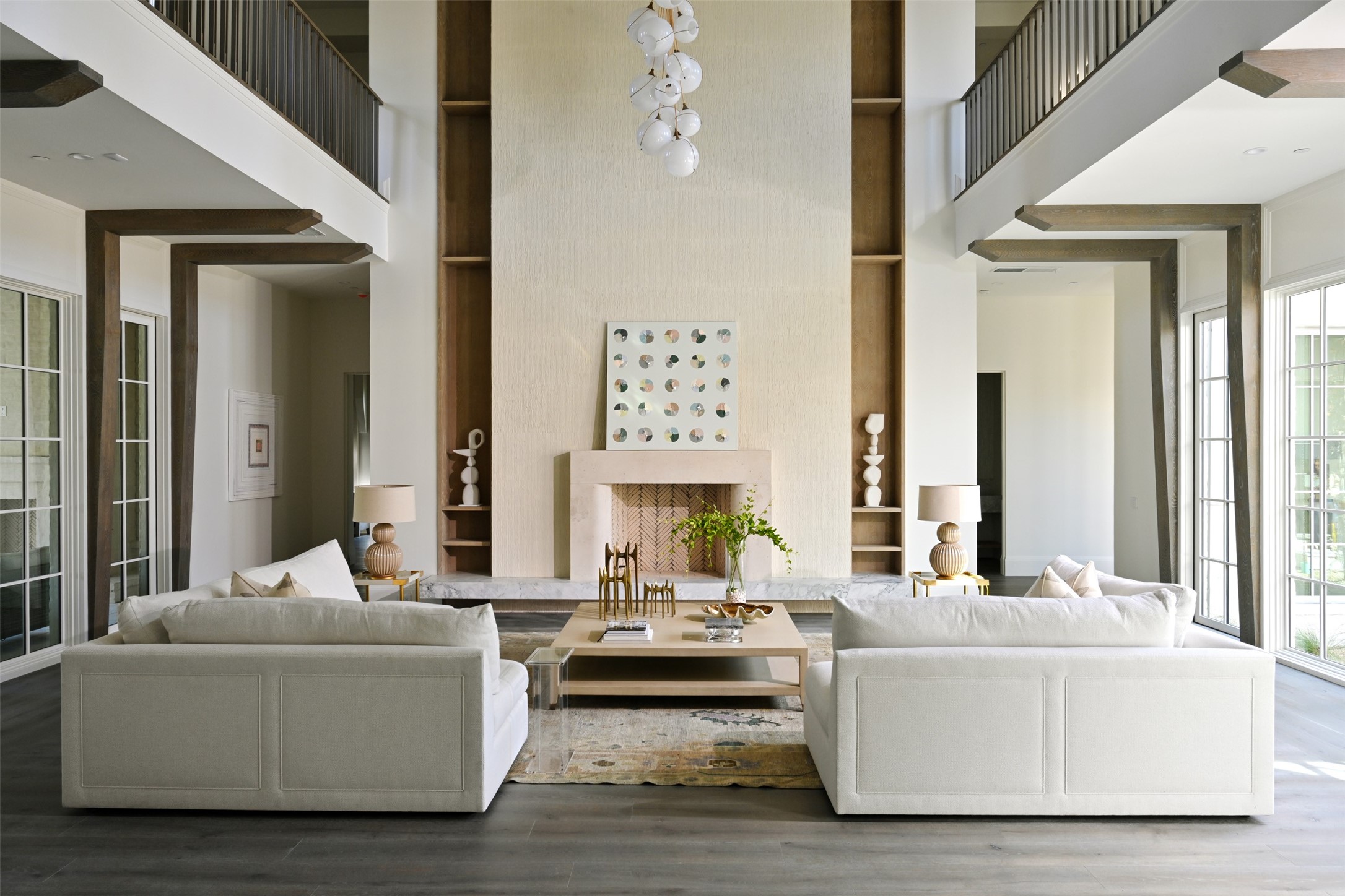 11710 Wendover Lane Houston, TX 77024 - Photo 5 of 50 Main living room with high ceilings, elegant finishes, and floor-to-ceiling windows providing natural light and access to both the back patio and entry garden