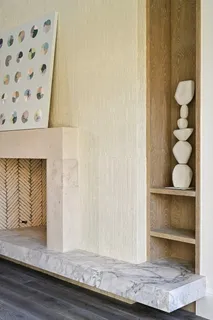 a view of a hallway with wooden floor and cabinet